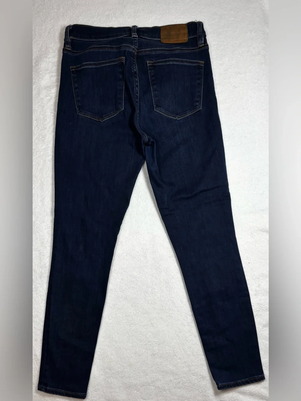 J.Crew jeans, Women’s high‑rise skinny size 27, dark wash, stretchy and sleek.